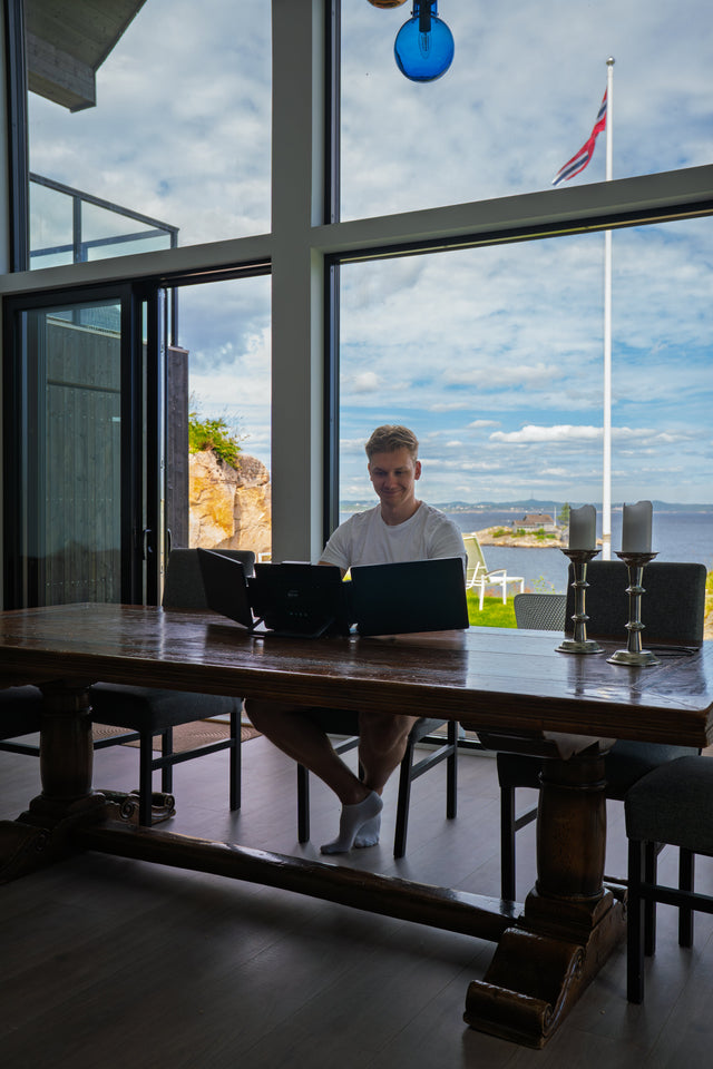 Portable screens set up on a dining table with a view